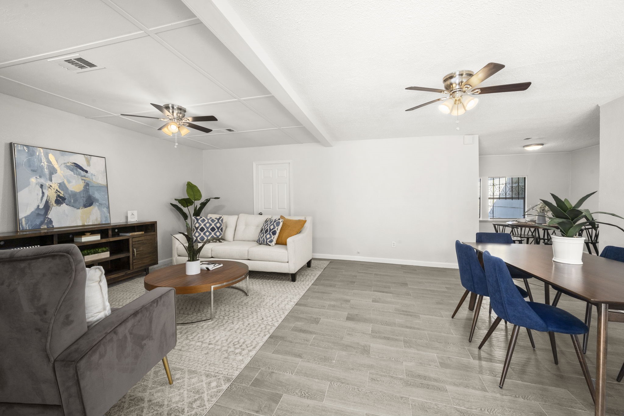 5219 Myrtlewood Street Houston, TX 77033 - Photo 3 of 36 a living room with furniture and a flat screen tv