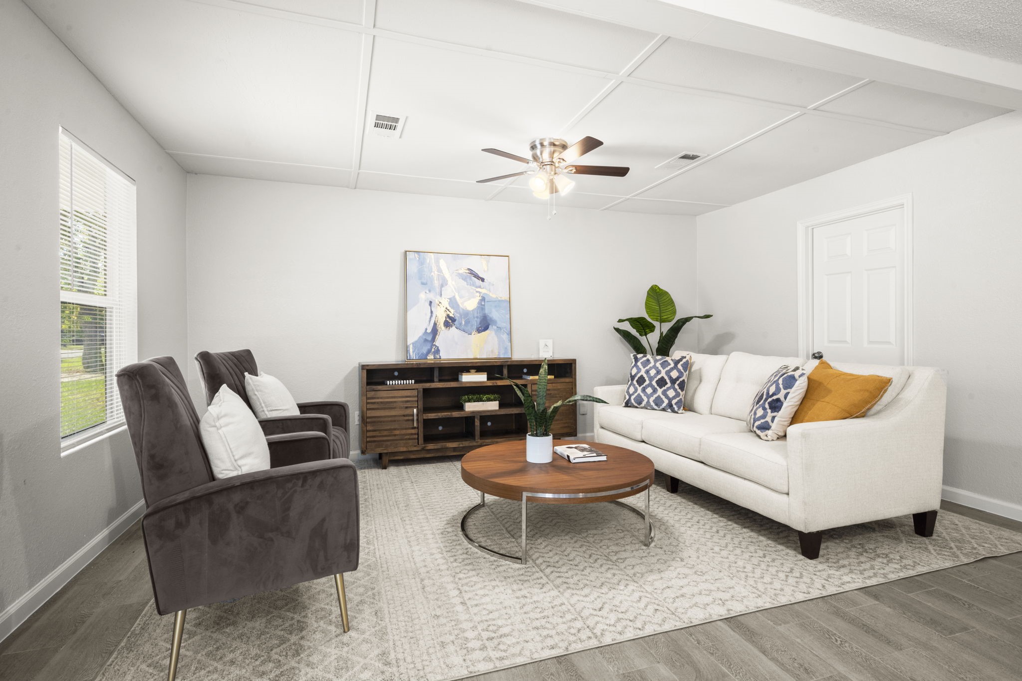 5219 Myrtlewood Street Houston, TX 77033 - Photo 4 of 36 a living room with furniture and wooden floor