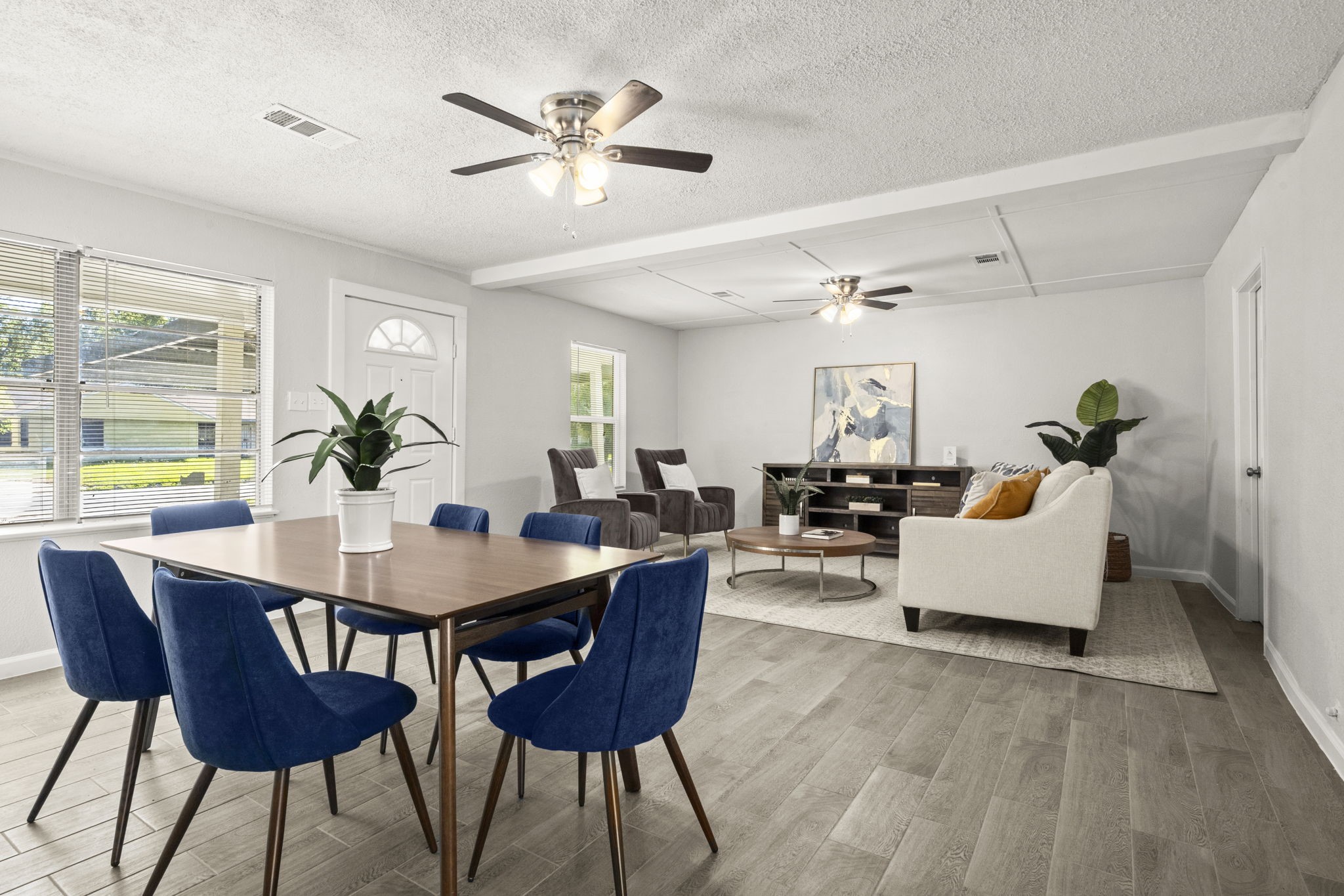 5219 Myrtlewood Street Houston, TX 77033 - Photo 5 of 36 a living room with furniture and wooden floor