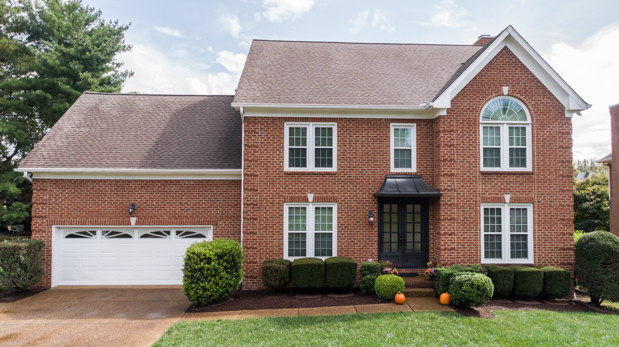 182 Scotsman Lane Franklin, TN 37064 - Photo 1 of 26 a front view of a house with a yard