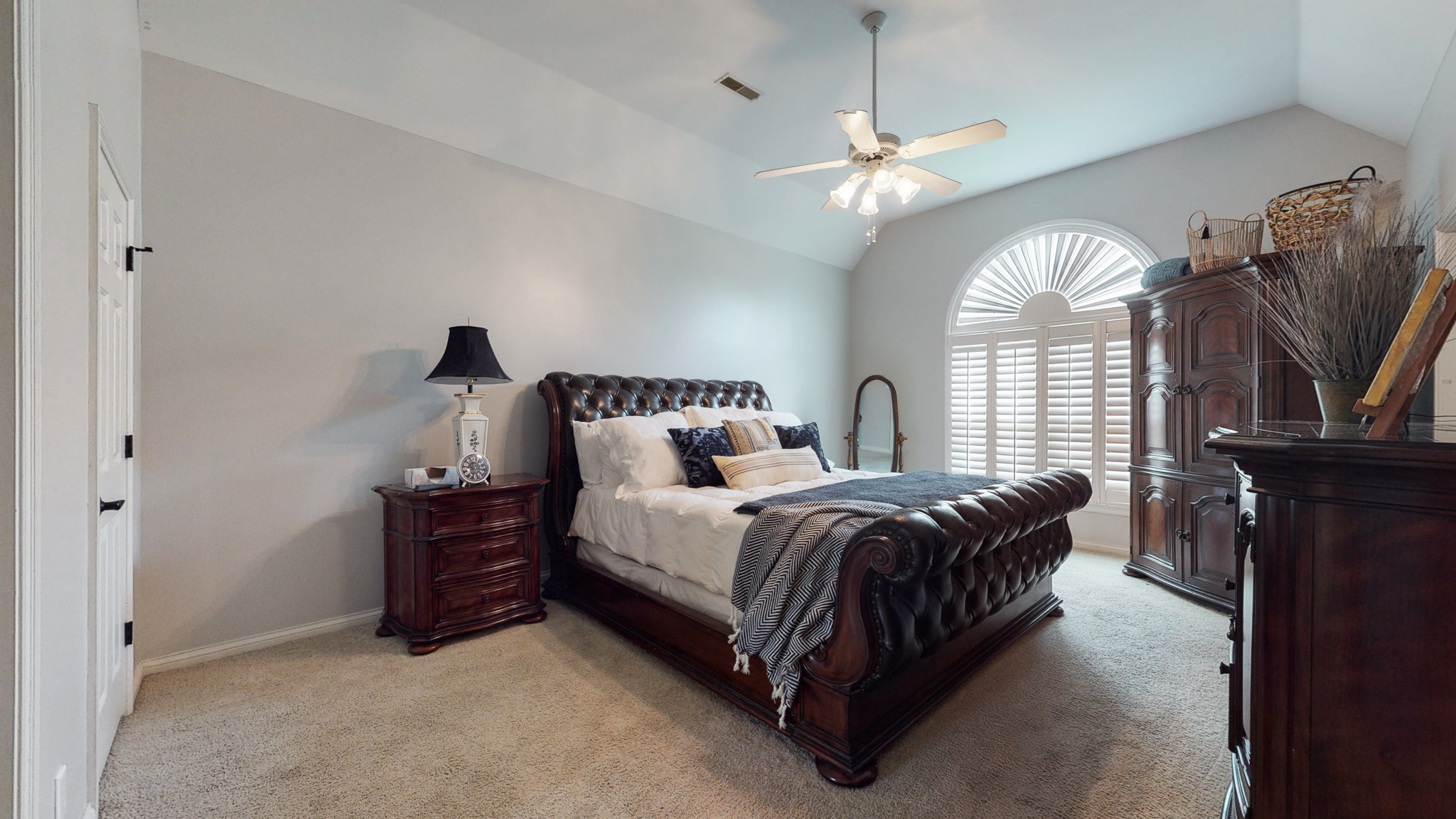 182 Scotsman Lane Franklin, TN 37064 - Photo 15 of 26 a spacious bedroom with a bed a chandelier and a large window