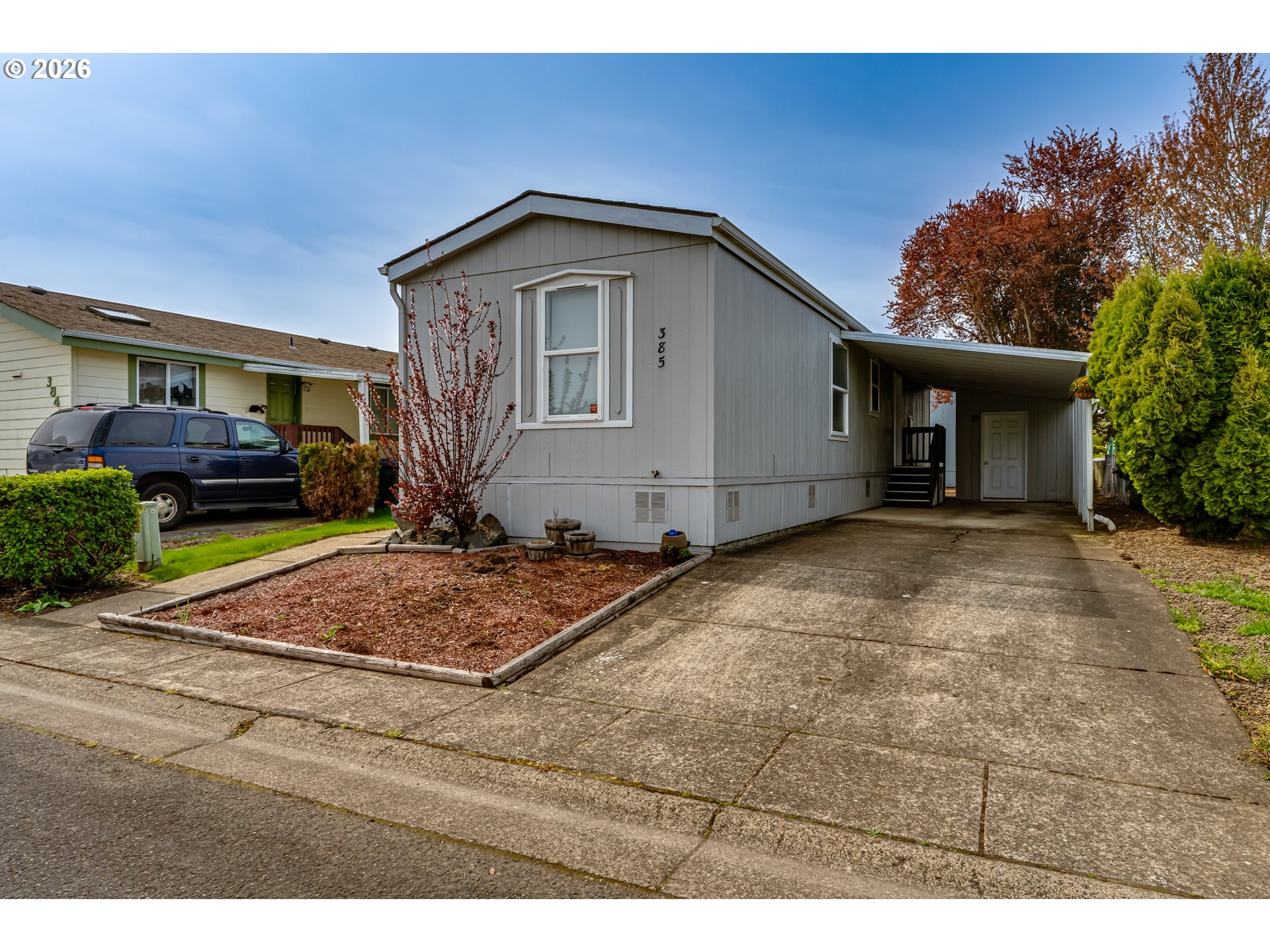 1699 North Terry Street Eugene, OR 97402 - Photo 17 of 30 a front view of a house with garden