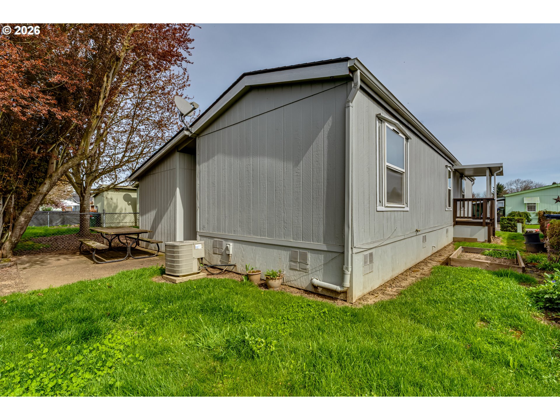 1699 North Terry Street Eugene, OR 97402 - Photo 19 of 30 a view of backyard with barbeque grill and a large tree