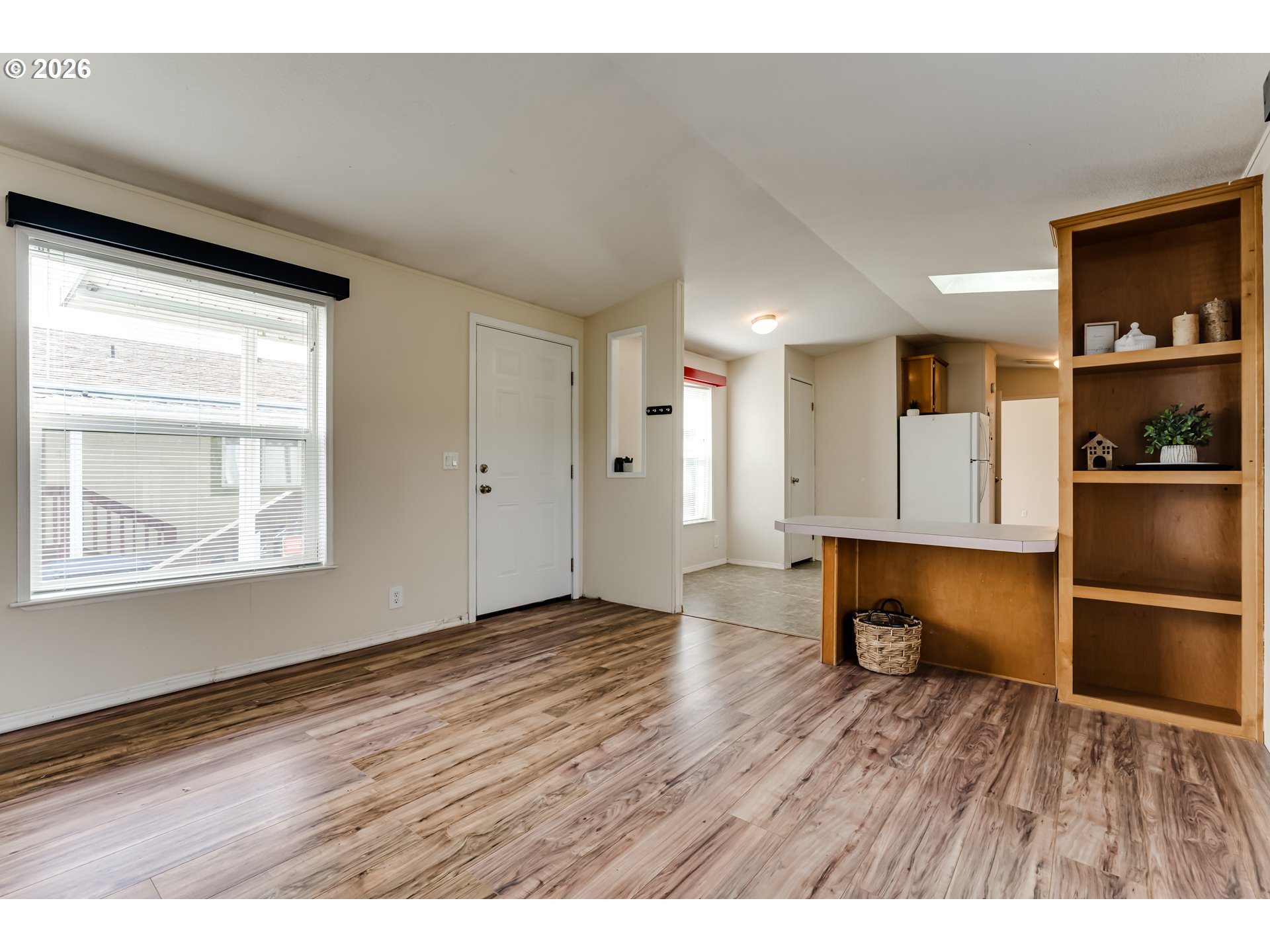 1699 North Terry Street Eugene, OR 97402 - Photo 2 of 30 a view empty room with wooden floor and kitchen