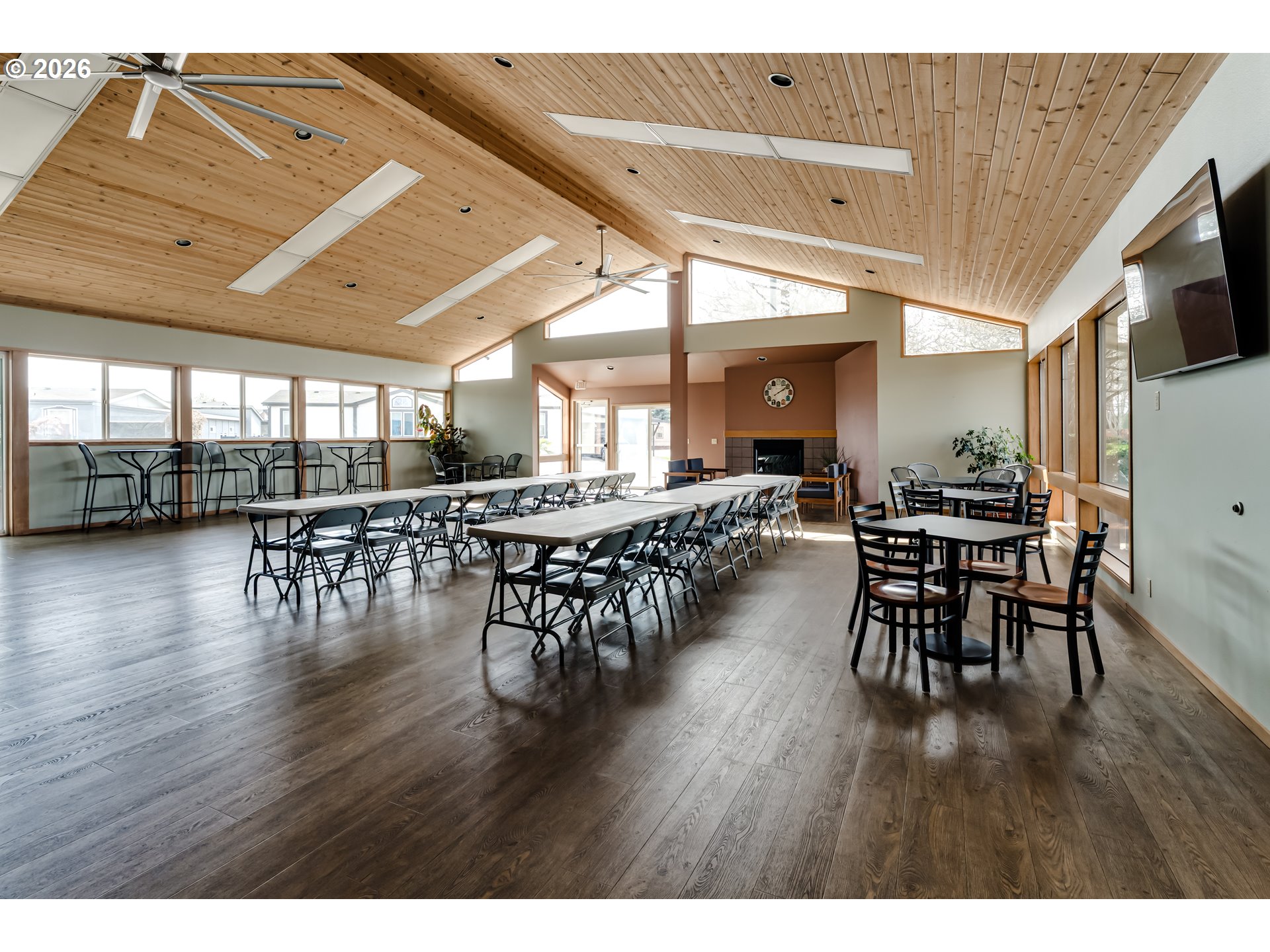 1699 North Terry Street Eugene, OR 97402 - Photo 24 of 30 a dining hall with stainless steel appliances granite countertop a table chairs and a chandelier