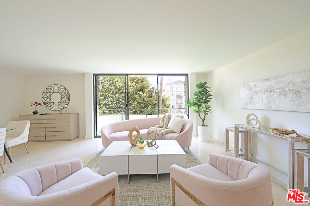 10535 Wilshire Boulevard, Unit 414 Los Angeles, CA 90024 - Photo 2 of 41 a living room with furniture and a large window