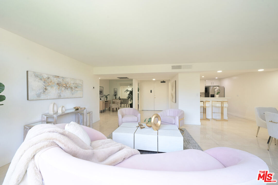 10535 Wilshire Boulevard, Unit 414 Los Angeles, CA 90024 - Photo 21 of 41 a living room with furniture and a wooden floor