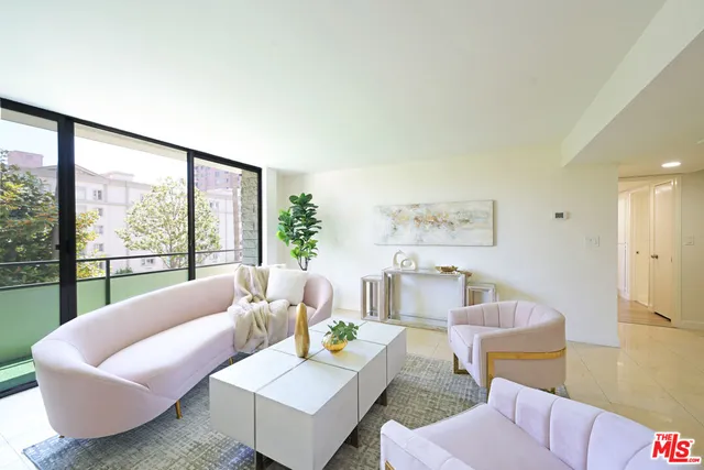 a living room with furniture and a large window