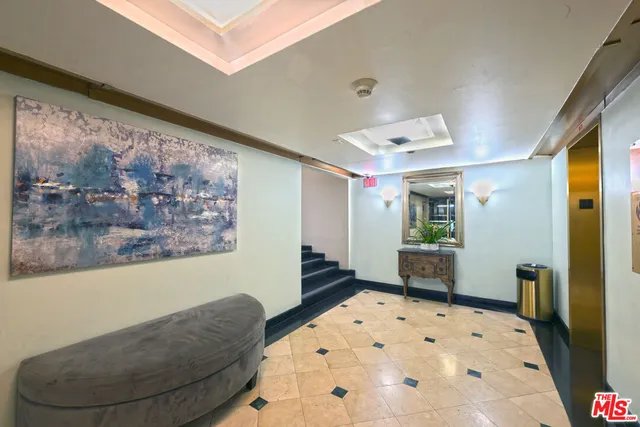 a living room with a large bed and a couch