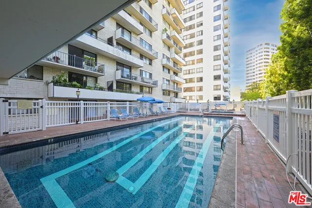 a view of a building with a backyard
