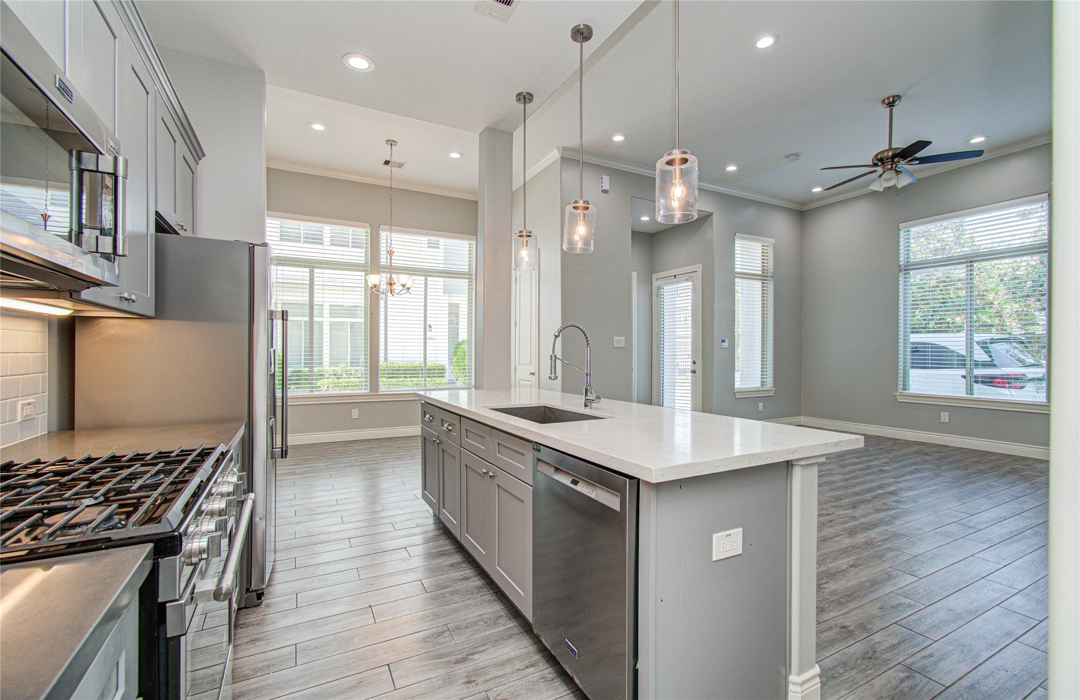 8903 Spring Knoll Forest Drive Houston, TX 77080 - Photo 7 of 29 a kitchen with stainless steel appliances granite countertop a sink stove and refrigerator
