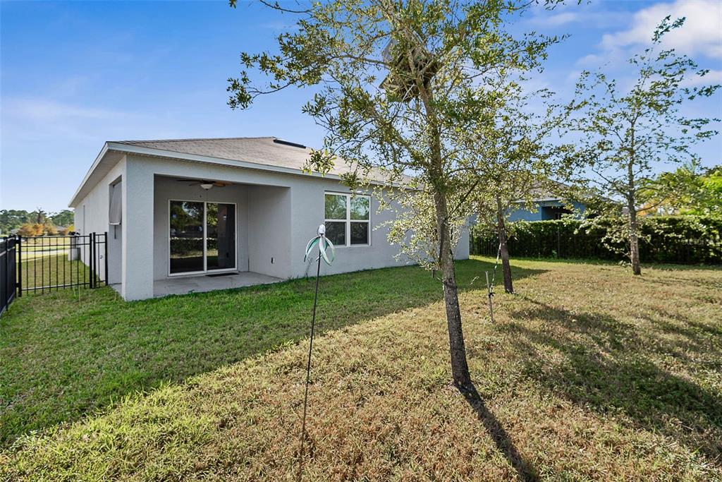 247 Old Mill Edgewater, FL 32141 - Photo 39 of 67 a view of a house with a yard