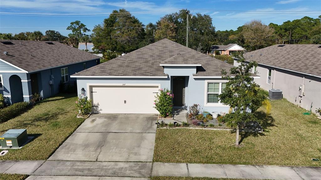 247 Old Mill Edgewater, FL 32141 - Photo 45 of 67 a aerial view of a house with a yard and potted plants