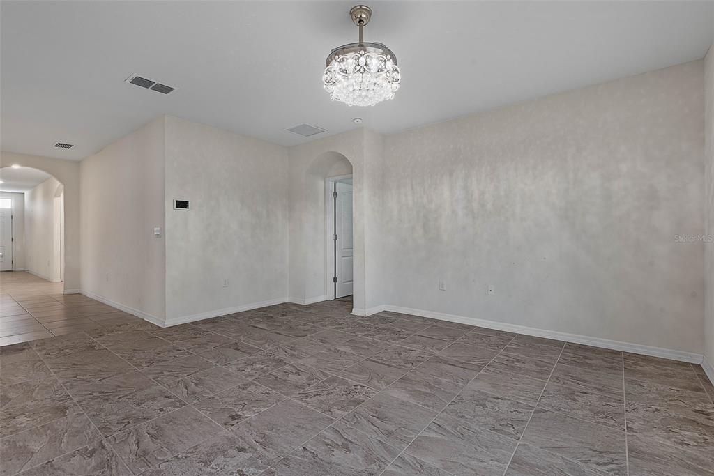 247 Old Mill Edgewater, FL 32141 - Photo 7 of 67 a view of an empty room with a window