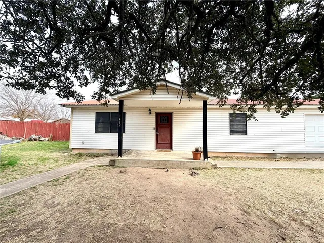 a house with trees in front of it