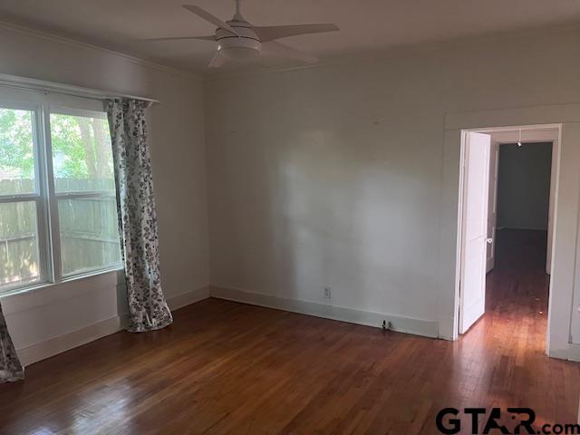 617 West Dobbs Street Tyler, TX 75701 - Photo 17 of 19 an empty room with wooden floor and windows