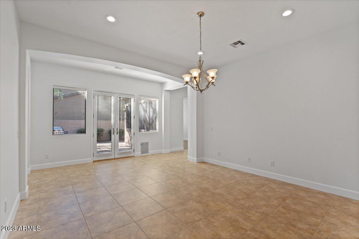 2413 West Sienna Bouquet Place Phoenix, AZ 85085 - Photo 11 of 61 a view of an empty room with glass door