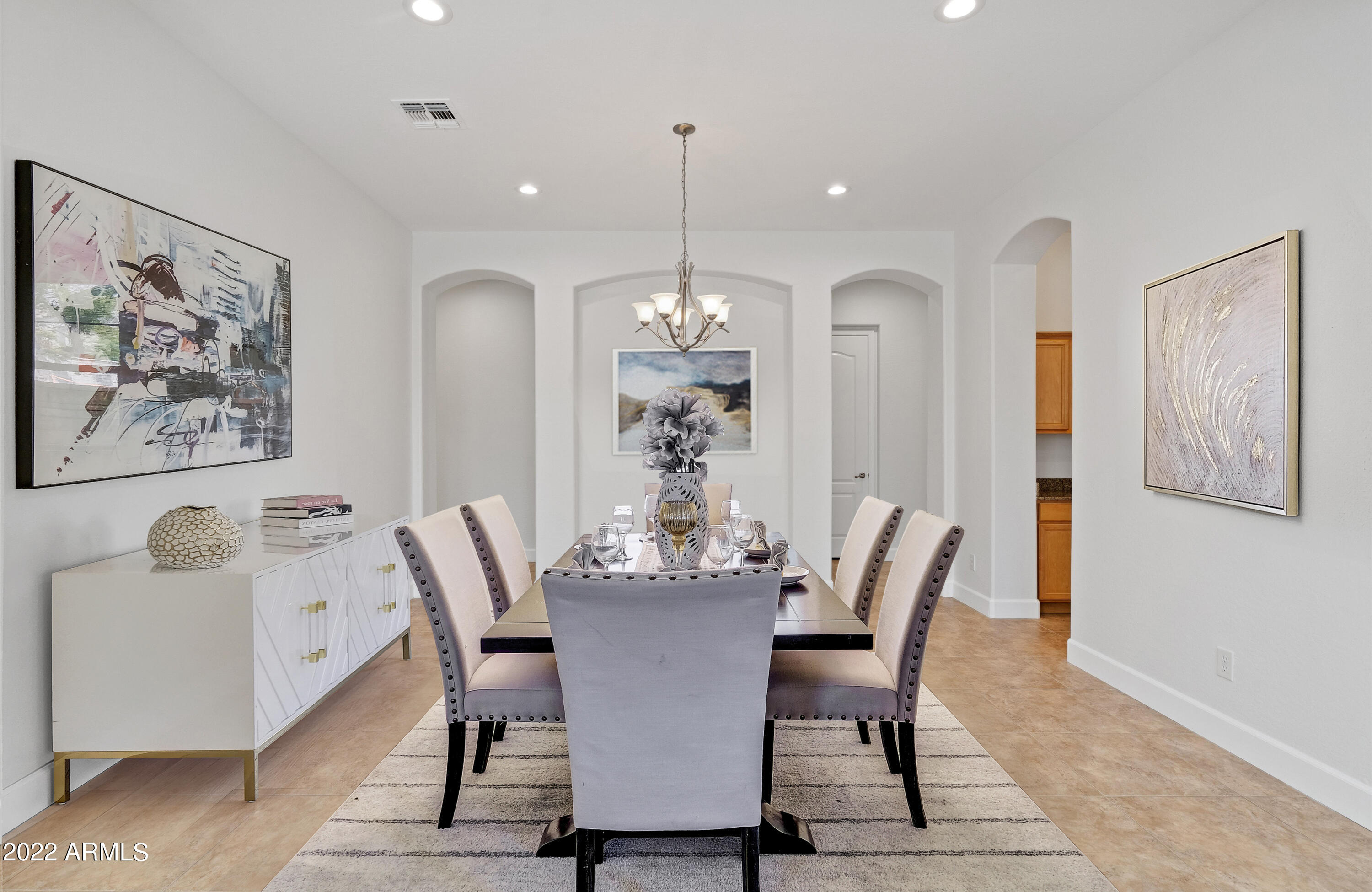 2413 West Sienna Bouquet Place Phoenix, AZ 85085 - Photo 13 of 61 a dining room with furniture and window