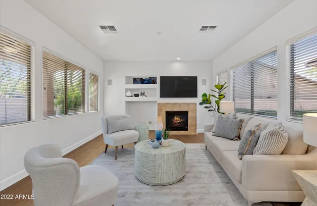 a view of kitchen with stainless steel appliances granite countertop a refrigerator and a stove
