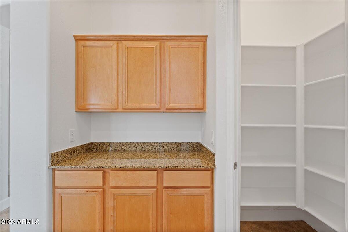 2413 West Sienna Bouquet Place Phoenix, AZ 85085 - Photo 25 of 61 a view of a kitchen with marble wall