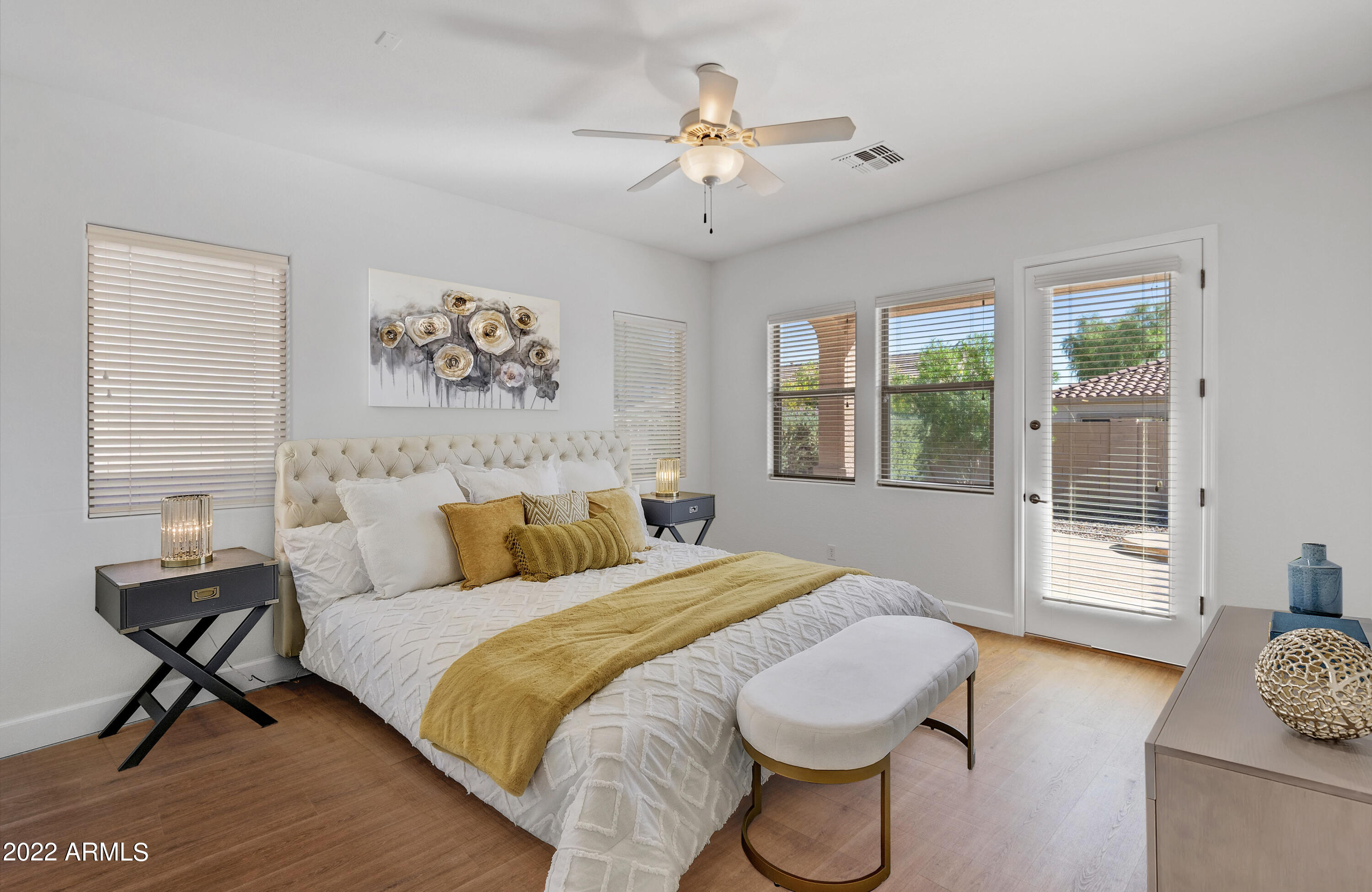 2413 West Sienna Bouquet Place Phoenix, AZ 85085 - Photo 27 of 61 a bedroom with a bed and wooden floor
