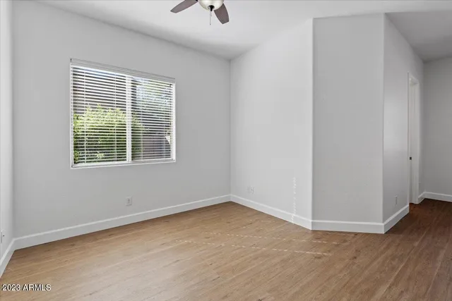 a bedroom with bed and a night stand