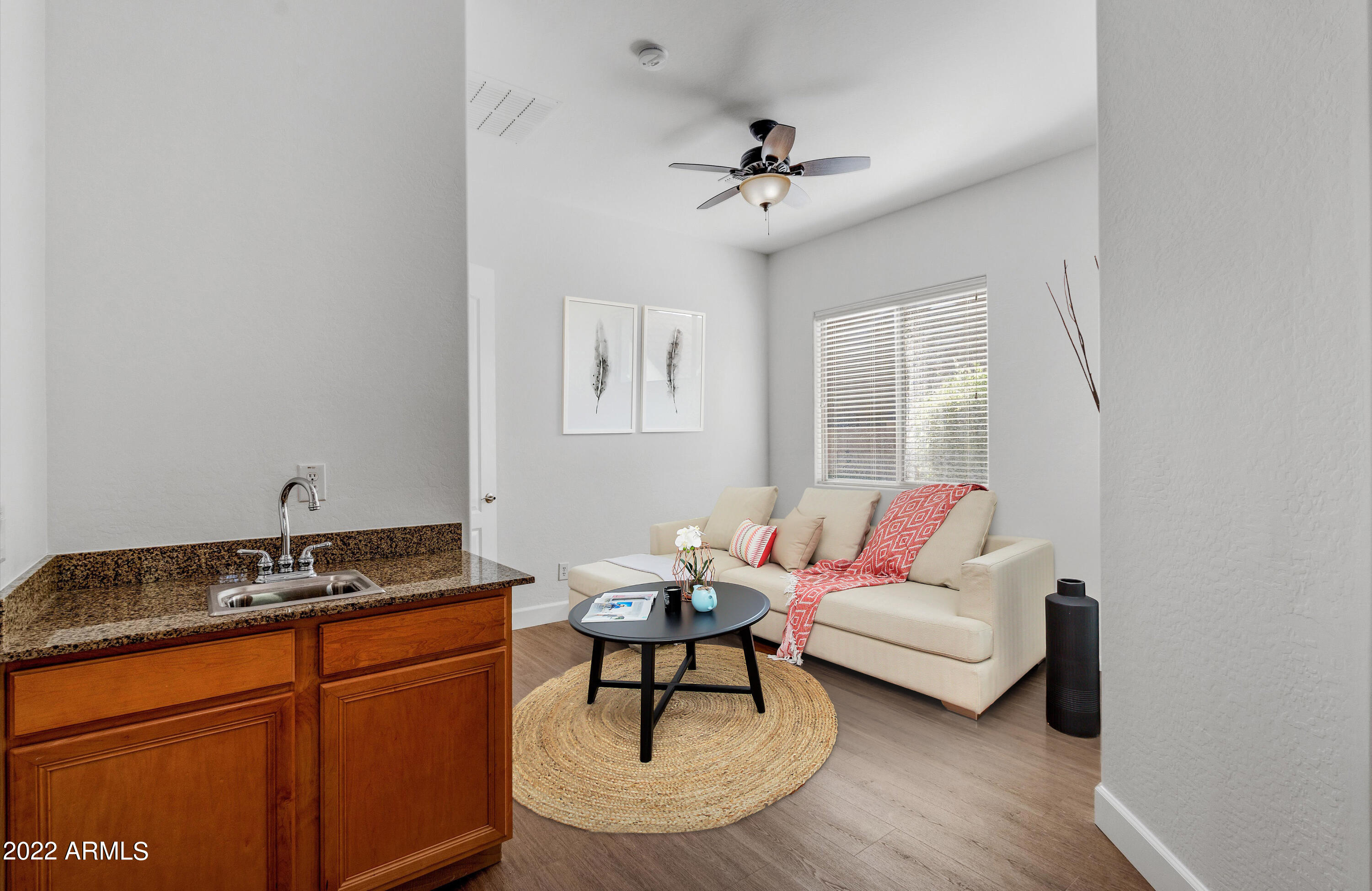 2413 West Sienna Bouquet Place Phoenix, AZ 85085 - Photo 38 of 61 a living room with furniture and a potted plant