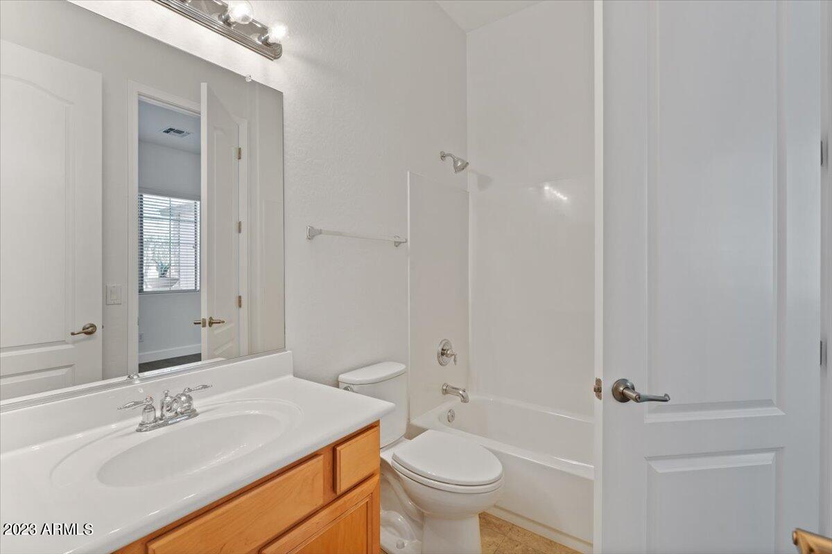 2413 West Sienna Bouquet Place Phoenix, AZ 85085 - Photo 44 of 61 a bathroom with a sink toilet and shower