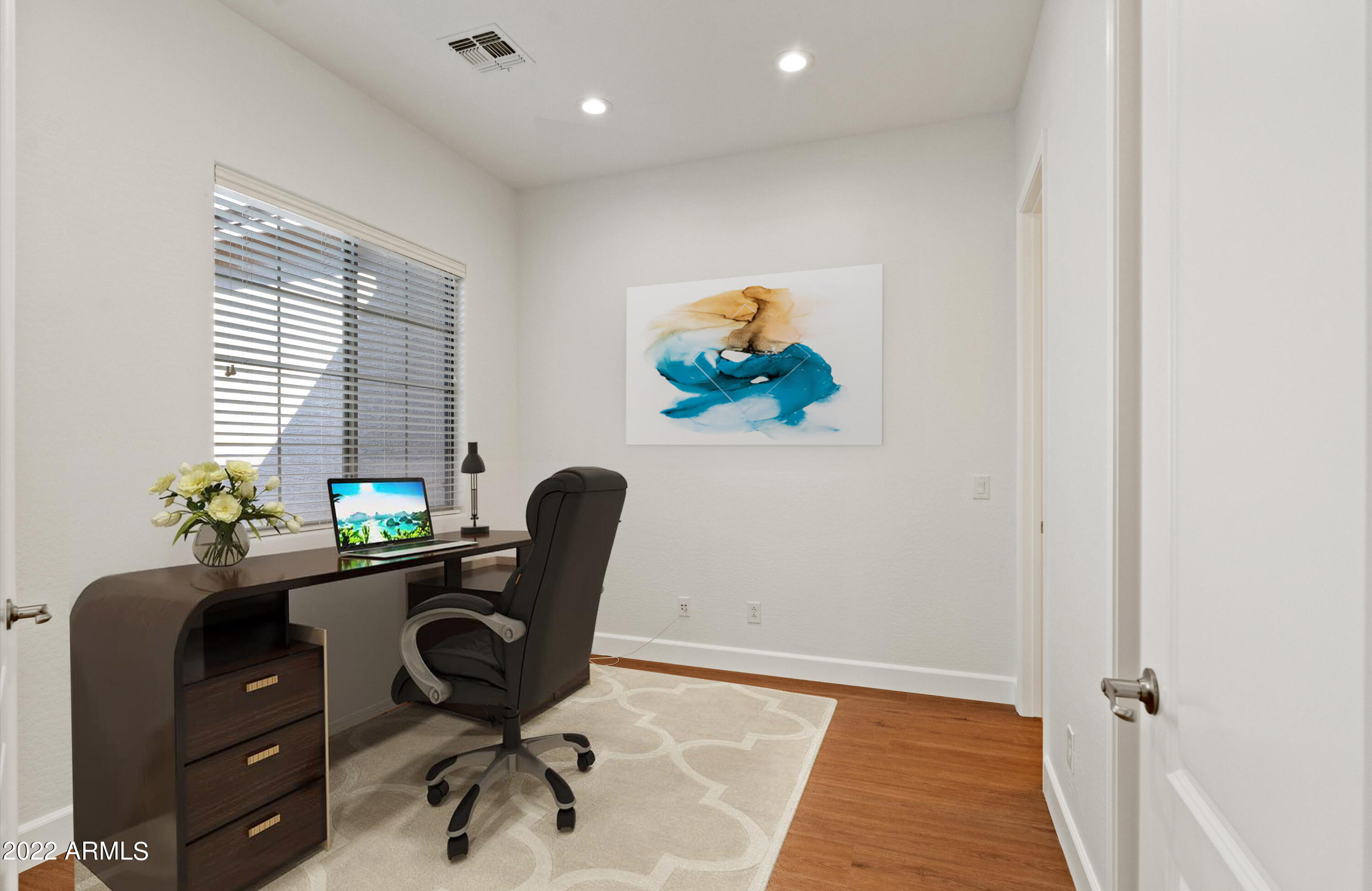 2413 West Sienna Bouquet Place Phoenix, AZ 85085 - Photo 46 of 61 a view of a workspace with furniture and a window