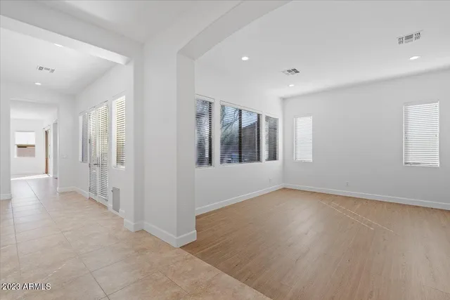 a view of an empty room with glass door