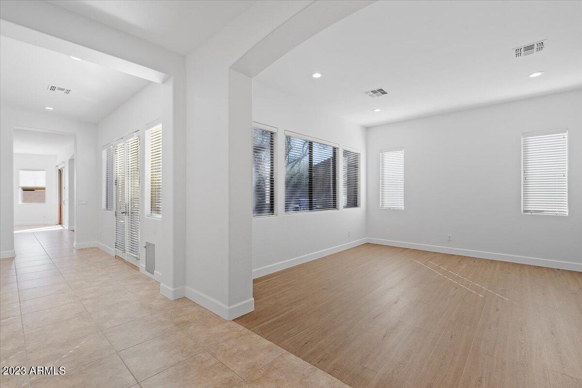 2413 West Sienna Bouquet Place Phoenix, AZ 85085 - Photo 9 of 61 a view of an empty room with a window
