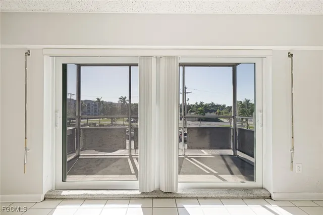 a view of a balcony with two chairs and a table