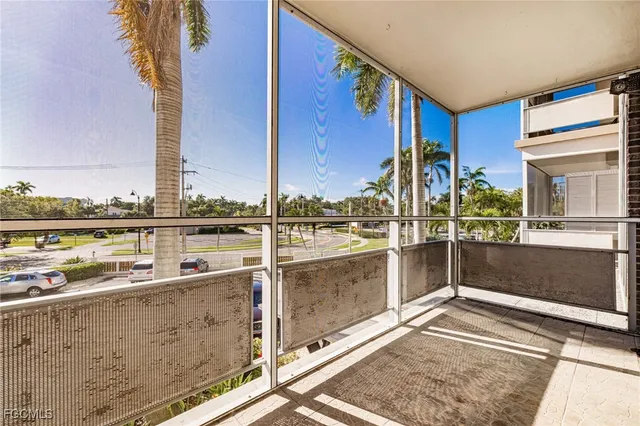 a view of a patio with a table and chairs