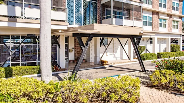 a building with swimming pool in front of it