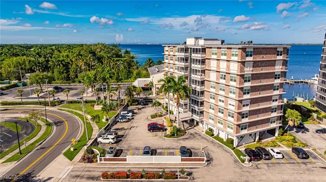 a view of swimming pool with outdoor seating and city view