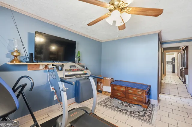 a living room with furniture and flat screen tv