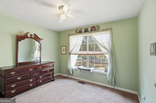 a room with a dresser and a mirror