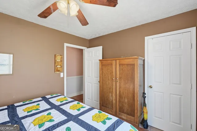 a room that has a bed and a closet in it