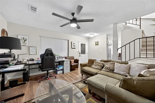 a work room with furniture and a window