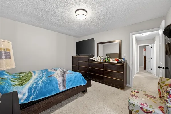 a living room with a bed and furniture