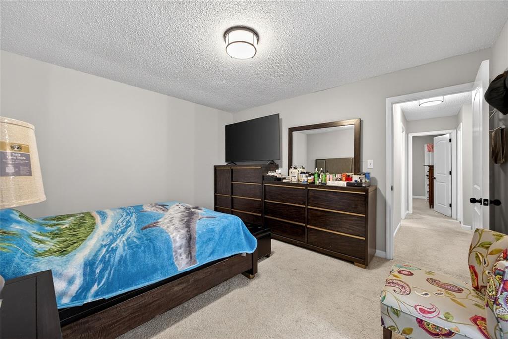 2739 Whitewater Court Austell, GA 30106 - Photo 13 of 18 a living room with a bed and furniture