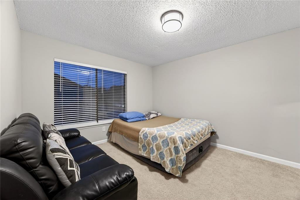 2739 Whitewater Court Austell, GA 30106 - Photo 17 of 18 a bedroom with a bed and a couch