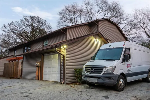 a view of a car park in front of house