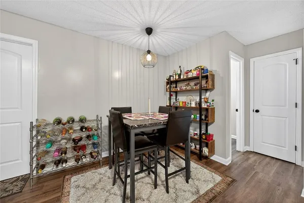 a view of a workspace with furniture and a kitchen