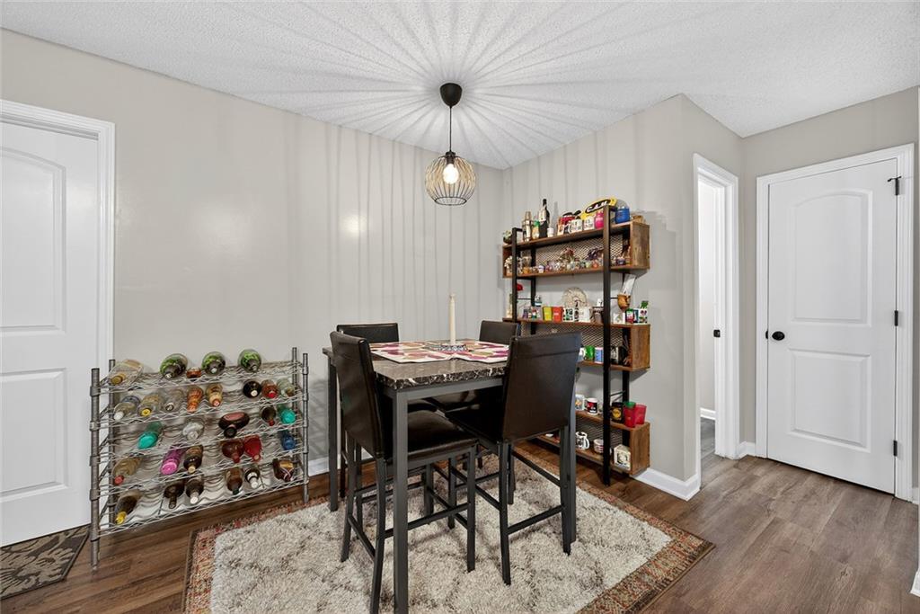 2739 Whitewater Court Austell, GA 30106 - Photo 6 of 18 a view of a workspace with furniture and a kitchen