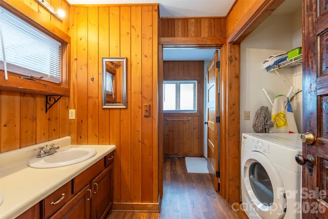 a view of a bathroom with a sink and a washer
