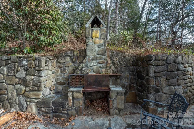 a view of house with yard and seating area