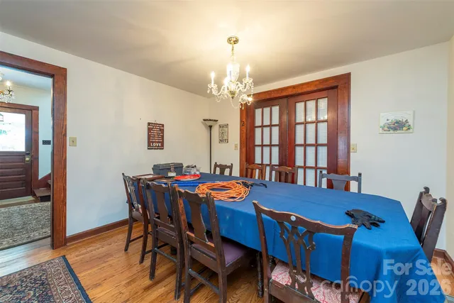 a view of a dining room with furniture and window