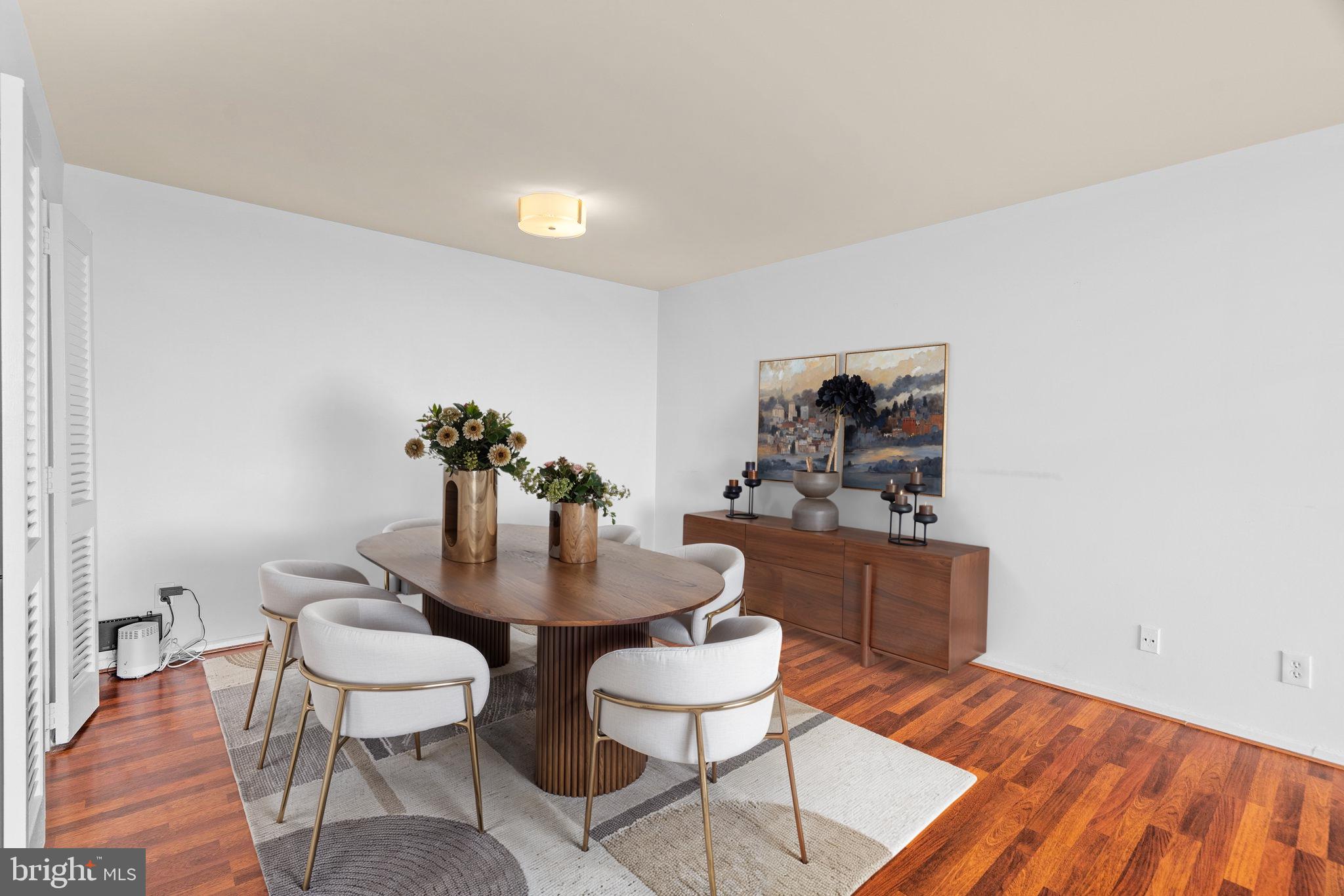 9701 Fields Road, Unit 1800 Gaithersburg, MD 20878 - Photo 5 of 16 a dining room with furniture and wooden floor