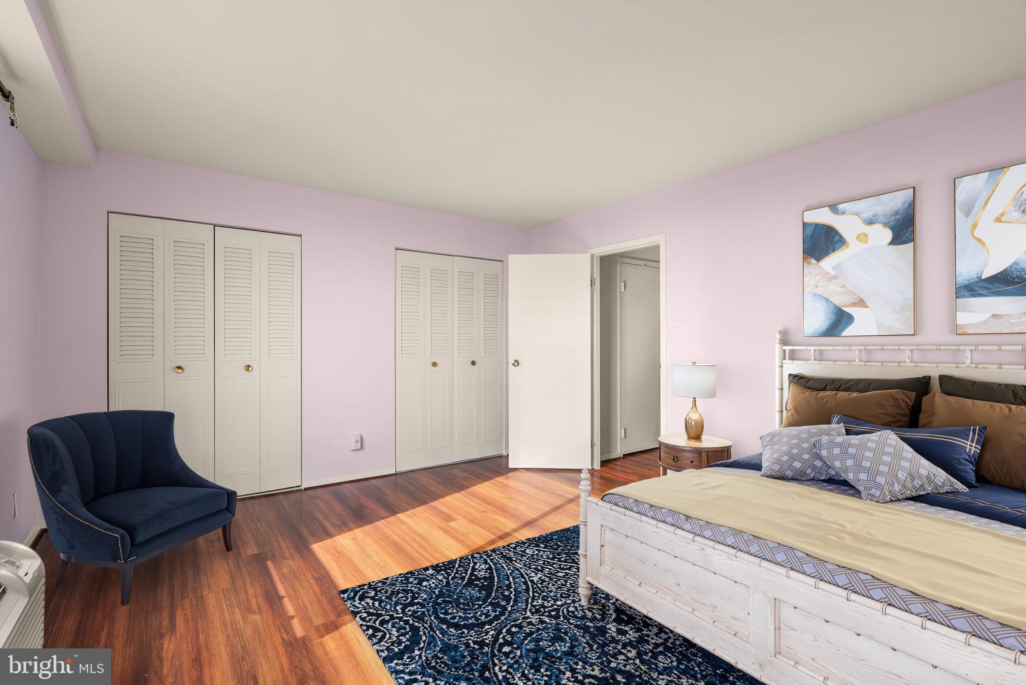 9701 Fields Road, Unit 1800 Gaithersburg, MD 20878 - Photo 7 of 16 a bedroom with a bed and a chair